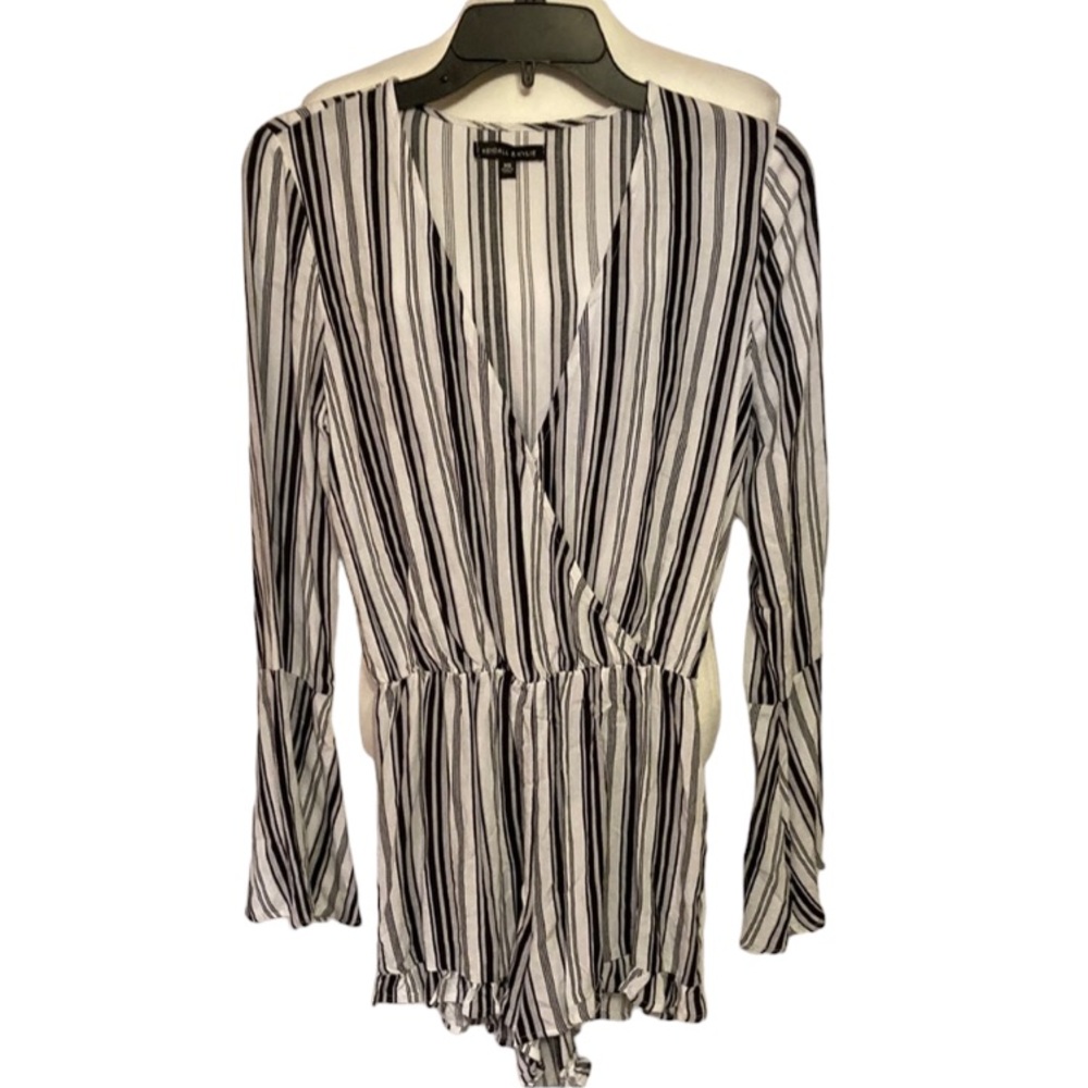 Kendall & Kylie white & black vertical striped romper. Trumpet sleeves
